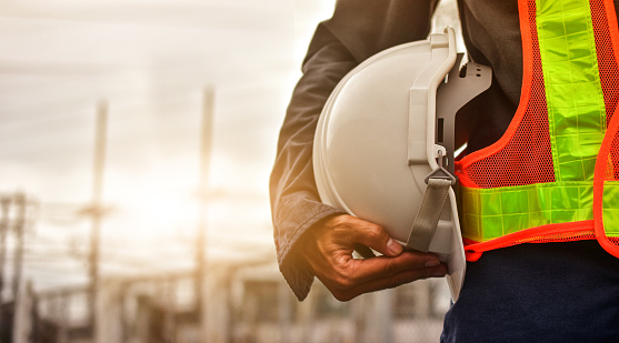 Worker Holding Hard Hat